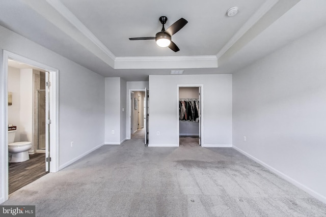 520 View Point Way, Fredericksburg, VA 22405 - unfurnished bedroom featuring a raised ceiling, carpet floors, a spacious closet, baseboards, and crown molding
