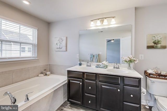 520 View Point Way, Fredericksburg, VA 22405 - full bath featuring toilet, double vanity, a bath, and a ceiling fan