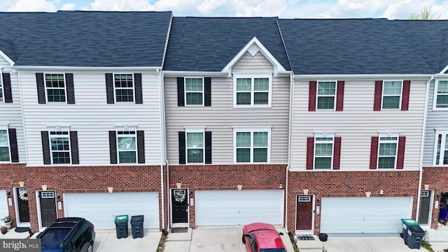 520 View Point Way, Fredericksburg, VA 22405 - view of property featuring brick siding, an attached garage, and driveway