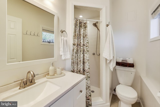 full bath with vanity, toilet, and a shower stall