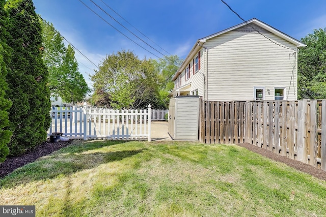 view of property exterior with a fenced backyard and a yard