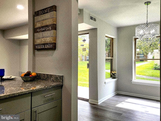 3811 Saint Barnabas Rd Unit T2, Suitland, MD 20746 - doorway to outside featuring dark wood-style floors, baseboards, healthy amount of natural light, and a chandelier