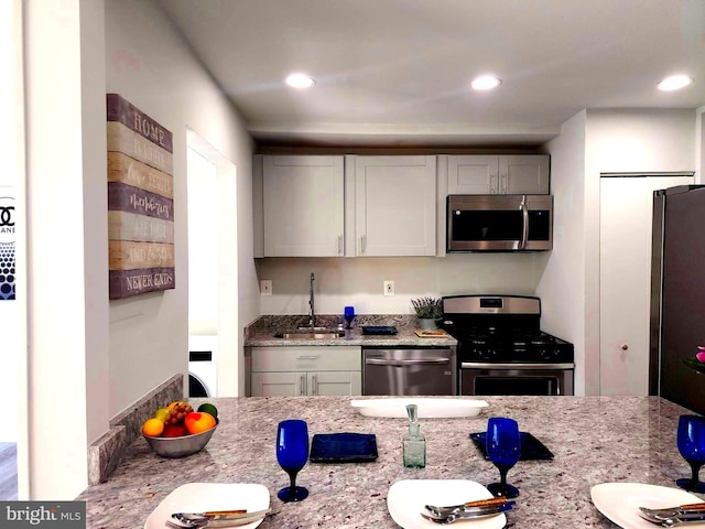 3811 Saint Barnabas Rd Unit T2, Suitland, MD 20746 - kitchen with stainless steel appliances, a sink, recessed lighting, and light stone counters
