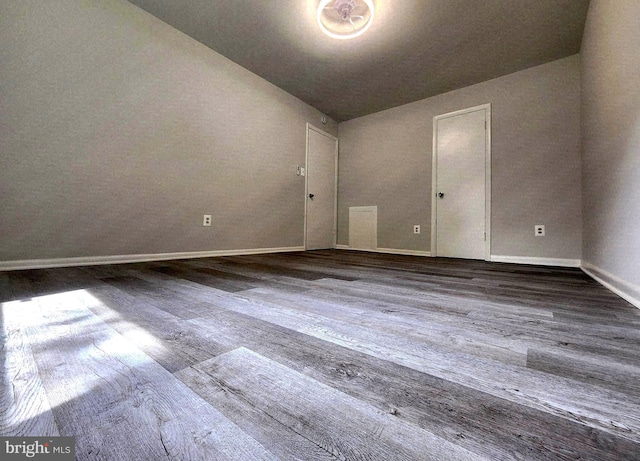 3811 Saint Barnabas Rd Unit T2, Suitland, MD 20746 - empty room with baseboards, wood finished floors, and lofted ceiling
