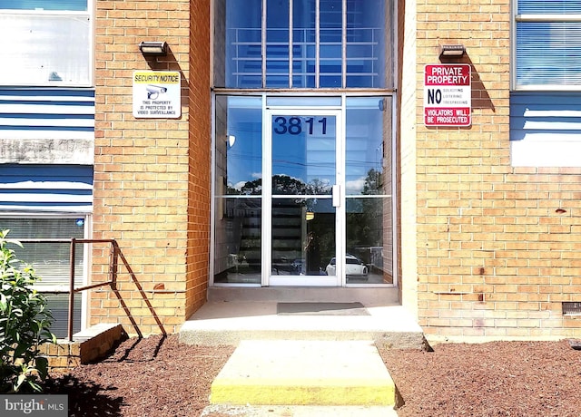 3811 Saint Barnabas Rd Unit T2, Suitland, MD 20746 - view of exterior entry with brick siding