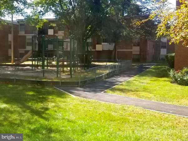 3811 Saint Barnabas Rd Unit T2, Suitland, MD 20746 - view of property's community with a yard