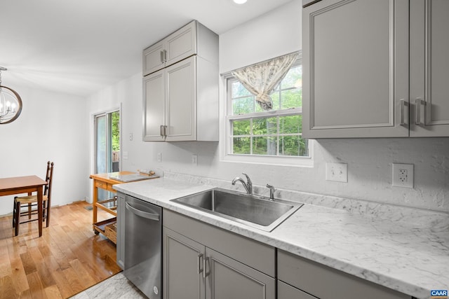 28 Begum Rd, Palmyra, VA 22963 - kitchen with gray cabinetry, stainless steel dishwasher, a sink, a chandelier, and light wood-style floors