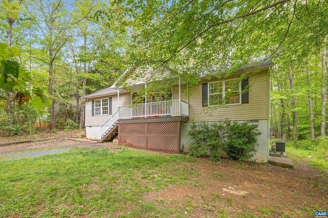 28 Begum Rd, Palmyra, VA 22963 - view of front of property with stairs, a wooden deck, a front lawn, and central AC