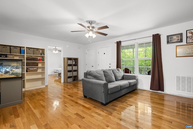 28 Begum Rd, Palmyra, VA 22963 - living room with light wood finished floors, a ceiling fan, and visible vents