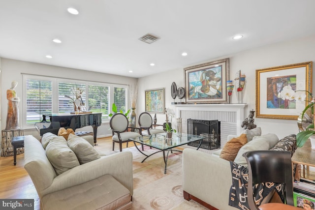 3305 Shirley Ln, Chevy Chase, MD 20815 - living room with recessed lighting, a fireplace, and light wood-style floors