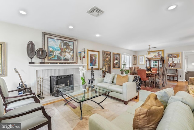 3305 Shirley Ln, Chevy Chase, MD 20815 - living room with a brick fireplace, recessed lighting, and wood finished floors