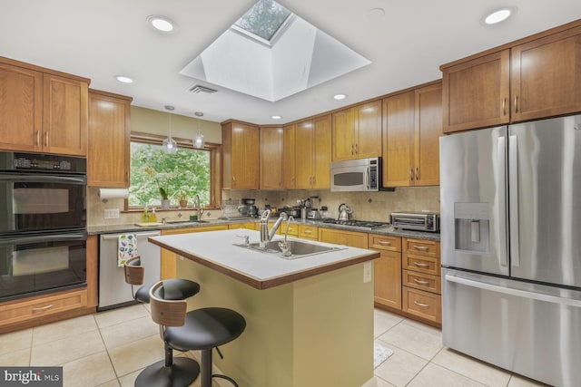 3305 Shirley Ln, Chevy Chase, MD 20815 - kitchen featuring stainless steel appliances, a sink, light tile patterned floors, decorative backsplash, and recessed lighting