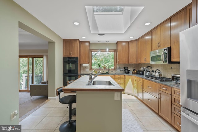 3305 Shirley Ln, Chevy Chase, MD 20815 - kitchen with a sink, stainless steel appliances, light tile patterned floors, plenty of natural light, and recessed lighting