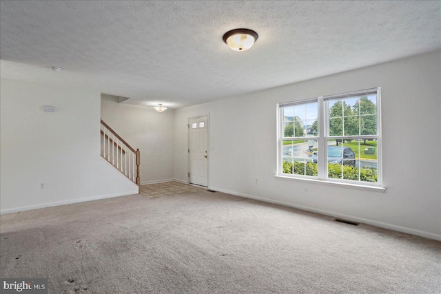 104 Seabreeze, Winchester, VA 22602 - carpeted foyer entrance with stairway, baseboards, and a textured ceiling