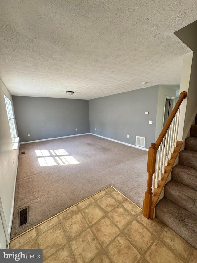 104 Seabreeze, Winchester, VA 22602 - carpeted empty room with visible vents, a textured ceiling, and baseboards