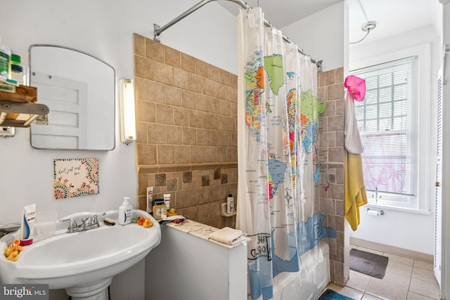 5217 Greene St, Philadelphia, PA 19144 - full bathroom featuring tile patterned floors, tile walls, a sink, and shower / tub combo with curtain