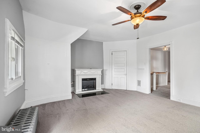 5217 Greene St, Philadelphia, PA 19144 - unfurnished living room with carpet floors, a glass covered fireplace, radiator heating unit, a ceiling fan, and visible vents