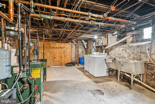 5217 Greene St, Philadelphia, PA 19144 - unfinished below grade area with a sink, a heating unit, and washing machine and clothes dryer