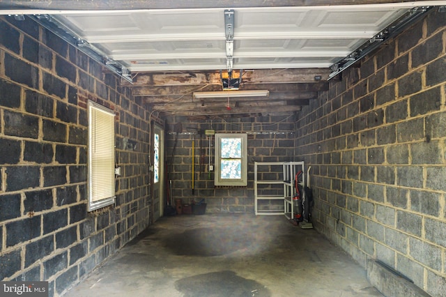 5217 Greene St, Philadelphia, PA 19144 - garage featuring concrete block wall and a garage door opener