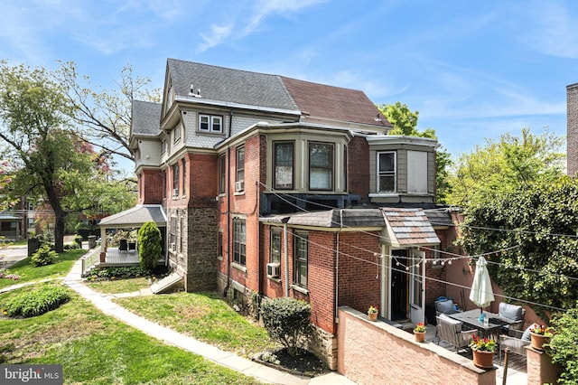 5217 Greene St, Philadelphia, PA 19144 - exterior space with a shingled roof and brick siding