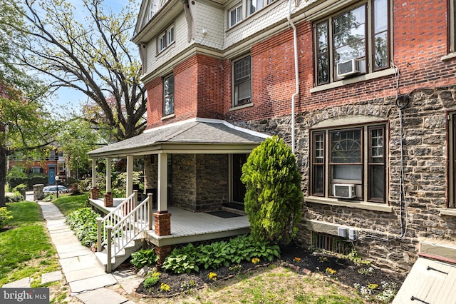 5217 Greene St, Philadelphia, PA 19144 - view of side of property featuring brick siding, stone siding, and cooling unit