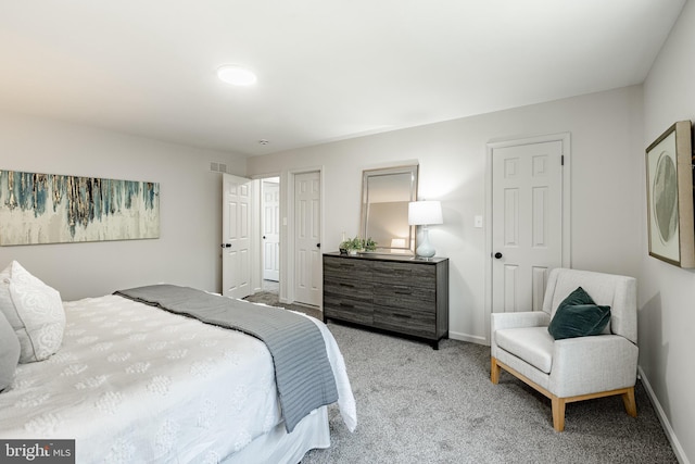 bedroom featuring carpet floors, baseboards, and visible vents
