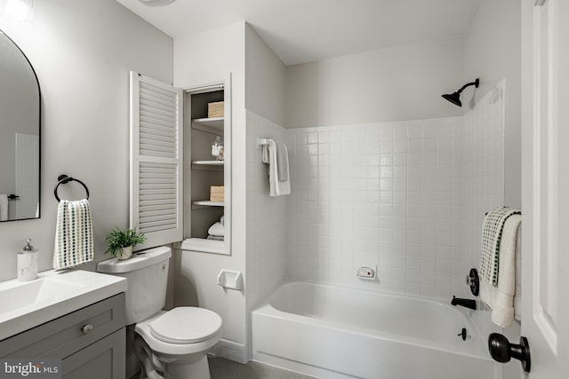 bathroom featuring vanity, toilet, and shower / tub combination