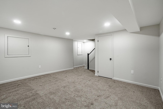finished basement with carpet floors, recessed lighting, baseboards, and stairs