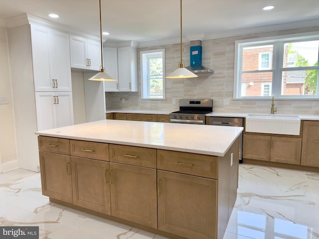 kitchen featuring backsplash, appliances with stainless steel finishes, a sink, marble finish floor, and wall chimney exhaust hood