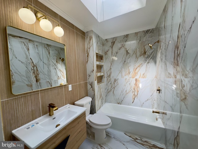 bathroom with vanity, toilet, shower / bath combination, tile walls, and ornamental molding