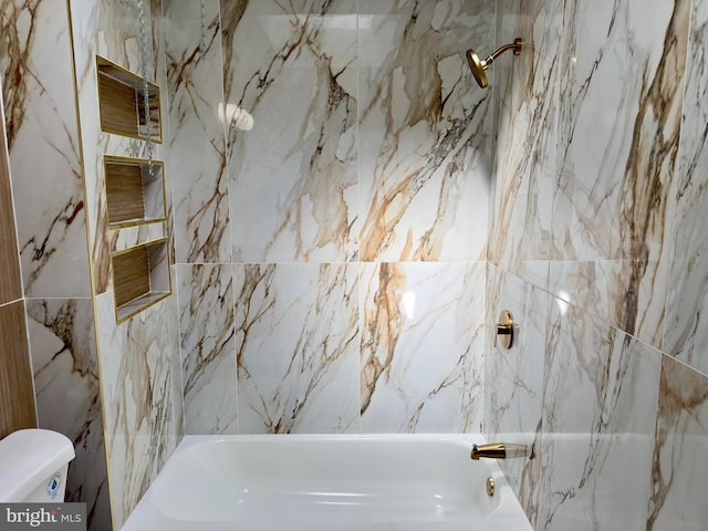 bathroom with shower / tub combination and toilet