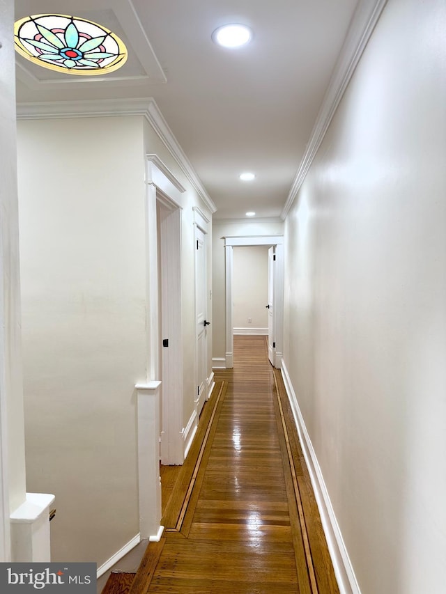 hall with crown molding, recessed lighting, baseboards, and dark wood finished floors