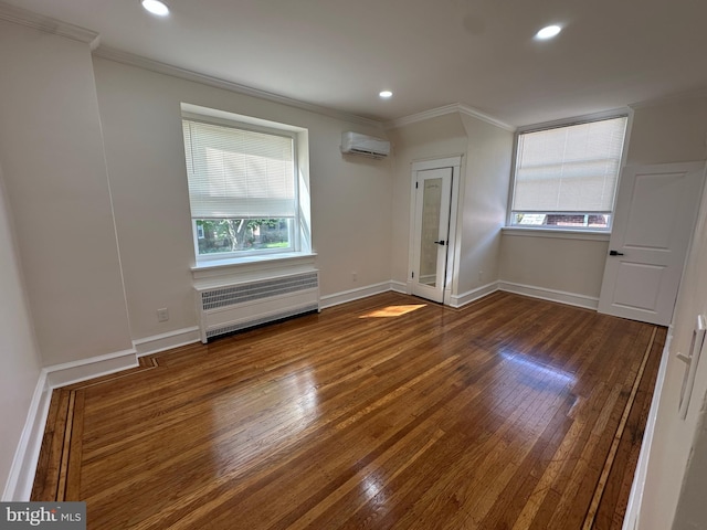 bonus room featuring baseboards, a wall mounted AC, radiator heating unit, and wood finished floors