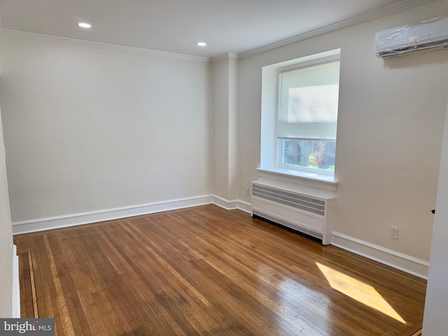 empty room with crown molding, a wall mounted air conditioner, wood finished floors, baseboards, and radiator