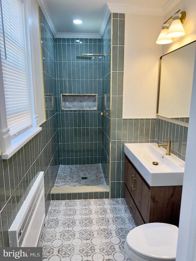 full bathroom with tile walls, ornamental molding, tiled shower, and radiator