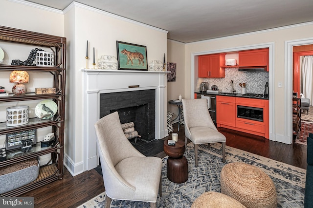 31 Palmer Sq W Unit A, Princeton, NJ 08542 - living area with a fireplace, dark wood finished floors, wet bar, baseboards, and ornamental molding