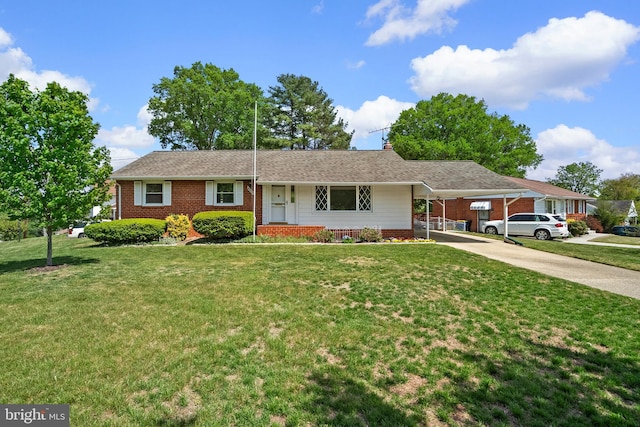 ranch-style house with brick siding, driveway, and a front yard