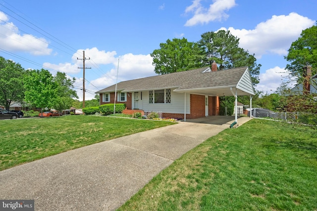 ranch-style home featuring fence, a shingled roof, a front lawn, brick siding, and concrete driveway