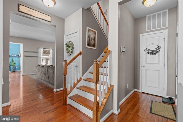10 Warbler Ct, Stafford, VA 22554 - foyer featuring visible vents, wood-type flooring, baseboards, and stairway
