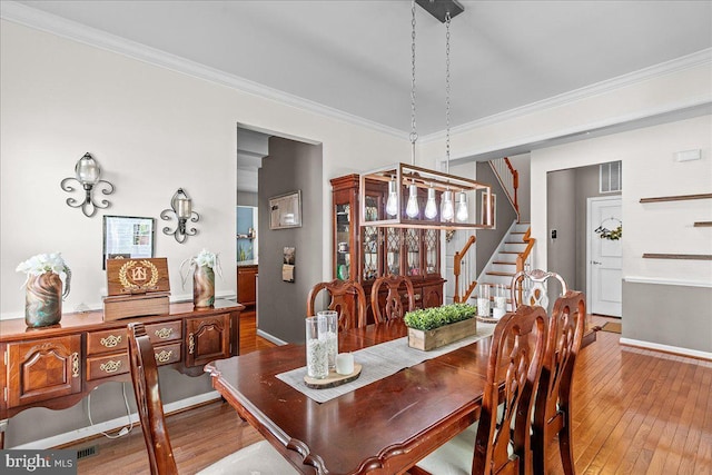 10 Warbler Ct, Stafford, VA 22554 - dining area with visible vents, crown molding, stairway, baseboards, and hardwood / wood-style floors