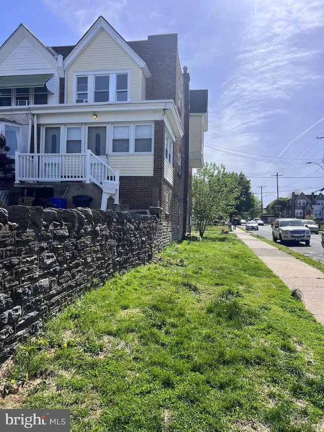 view of side of home with brick siding