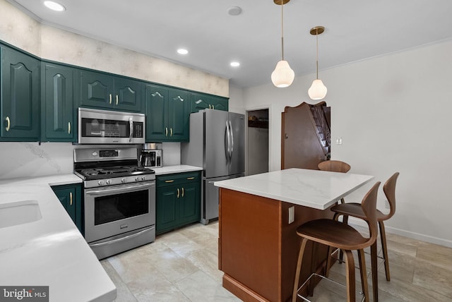 kitchen with green cabinetry, a center island, stainless steel appliances, a kitchen bar, and pendant lighting