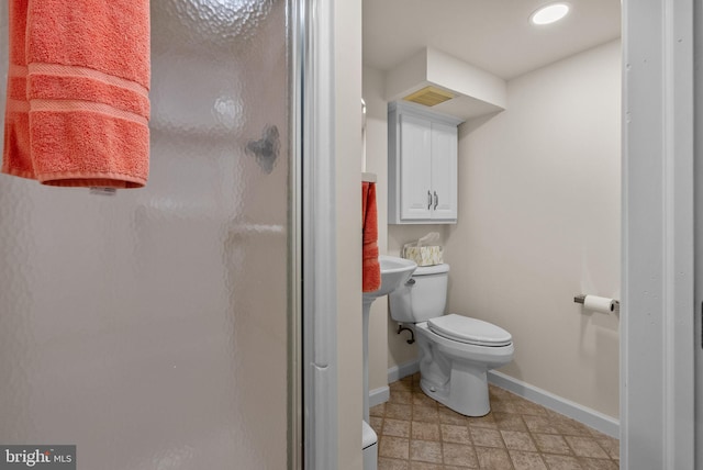 full bath with toilet, baseboards, recessed lighting, and a shower stall