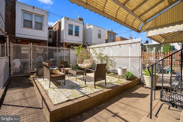view of patio with an outdoor hangout area and a fenced backyard