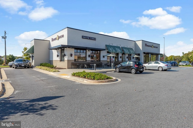 view of property featuring uncovered parking