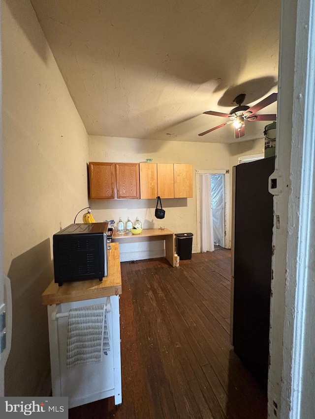 kitchen with dark wood-type flooring and a ceiling fan