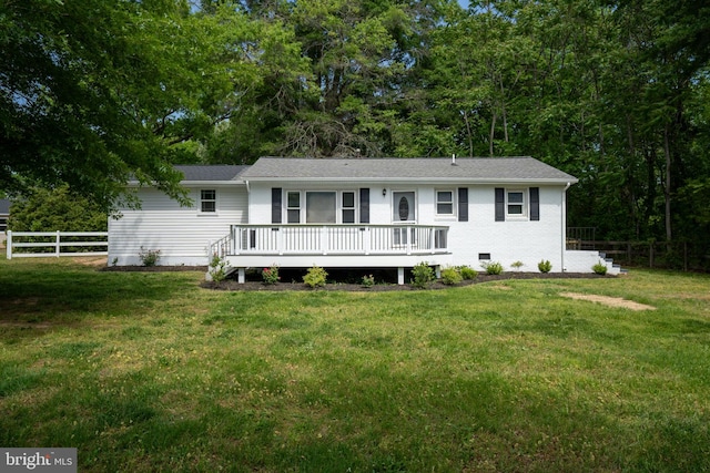 ranch-style home featuring fence, crawl space, a deck, and a front yard