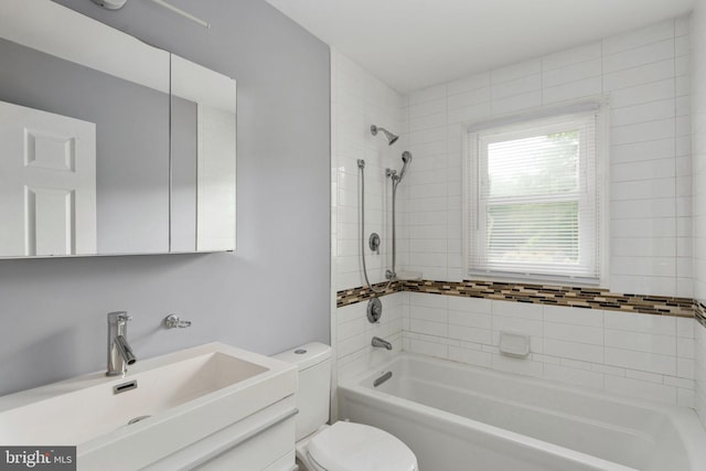 full bathroom featuring vanity, toilet, and bathtub / shower combination