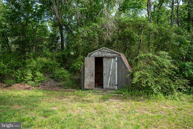 view of shed featuring a wooded view