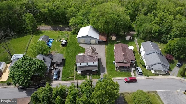 aerial view of residential area with a heavily wooded area